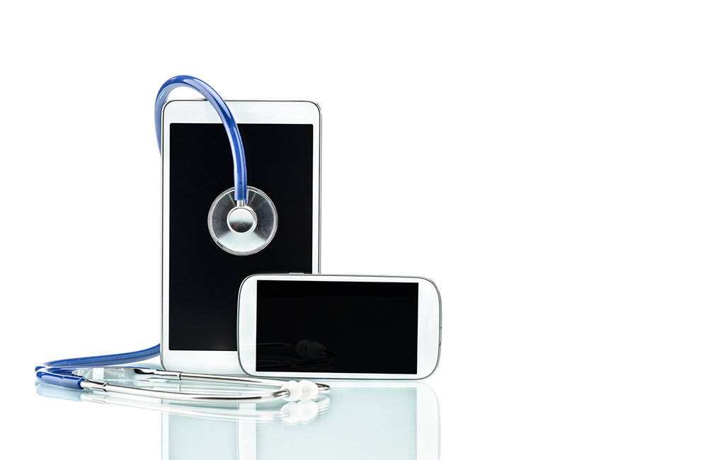 A tablet, cell phone, and stethoscope.