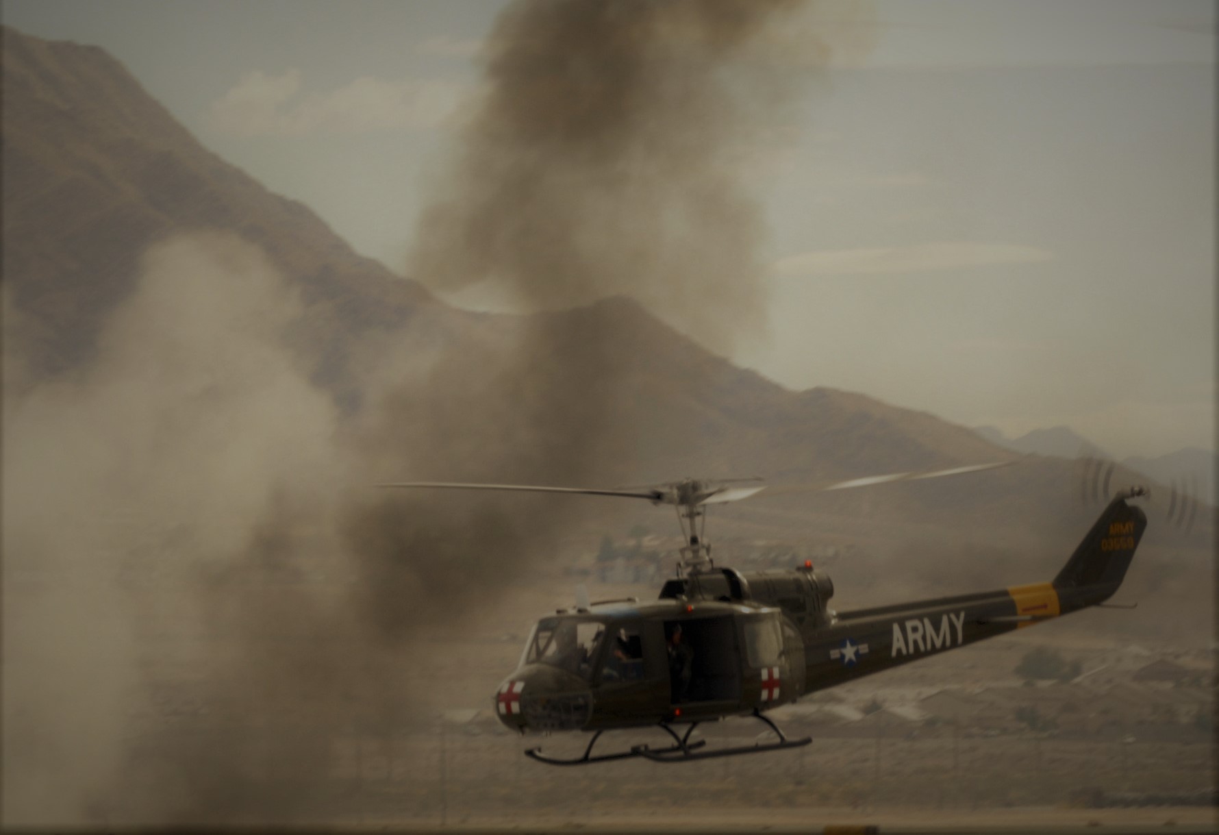 An UH-1 Huey helicopter prepares to land to pick up a downed pilot during a Vietnam war re-enactment during the Aviation Nation air show on Nellis Air Force Base, Nev., Nov. 11, 2007.